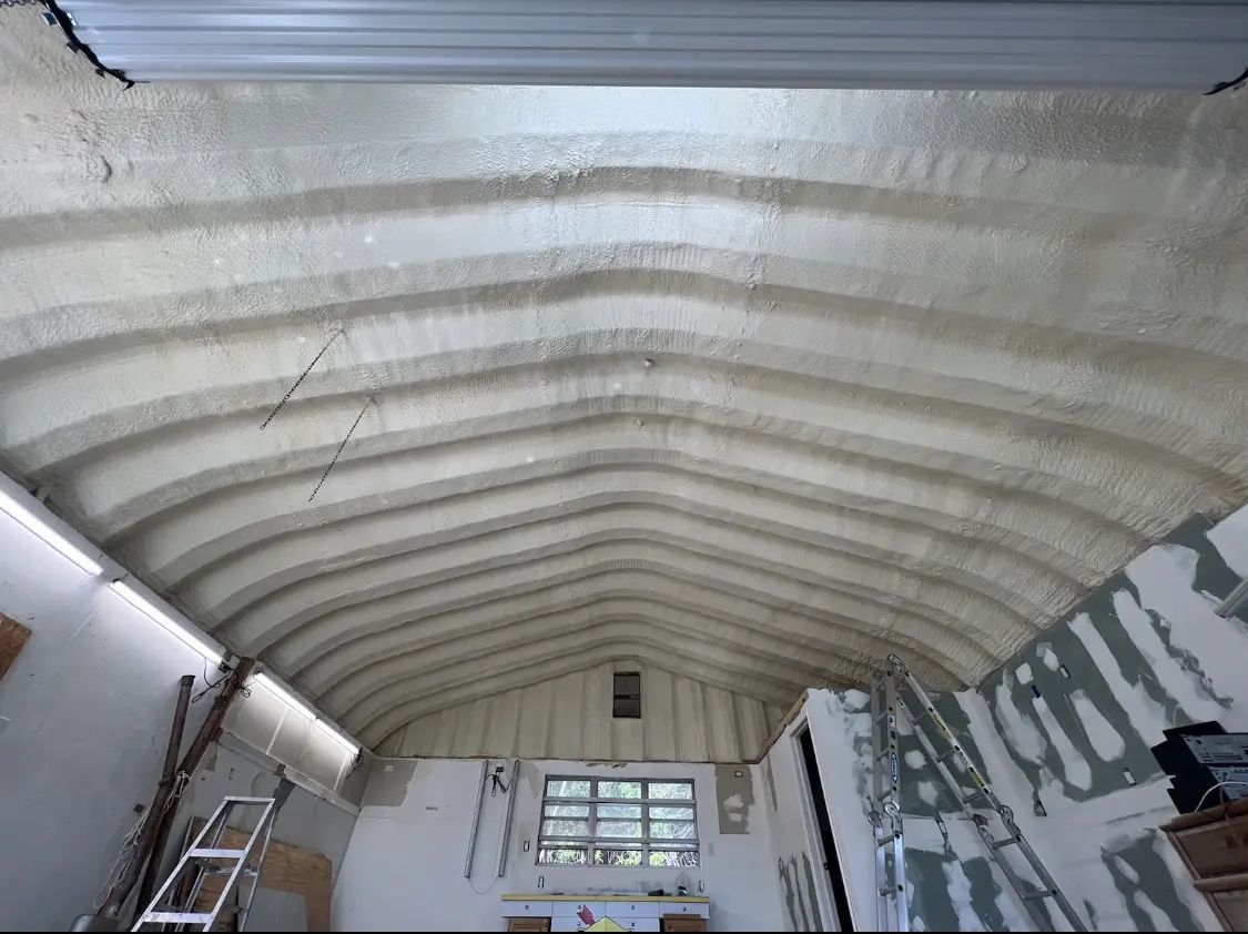Spray polyurethane foam applied to the underside of a metal roof deck in Salem